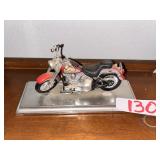 Red Cruiser Motorcycle Model on Display Base
