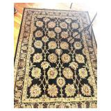BLACK AND CREME RUG WITH PAD UNDERNEATH 64X92