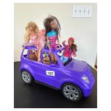 BARBIE CAR WITH 4 BARBIE DOLLS