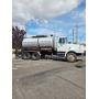 1996 Etnyre/Volvo Model S2000 Black Topper Distributor Truck