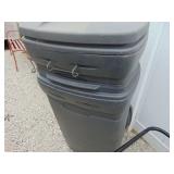 Two Rubbermaid Garbage Cans with lids