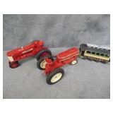 Two Tractors and a Train Car
