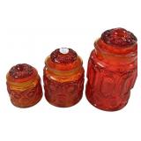Three Red Glass Canisters