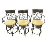 Three metal swivel brown counter height stool
