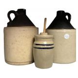 Two Brown Whiskey Jugs and Stoneware Butter