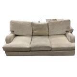 Beige Upholstered Three Cushion Sofa