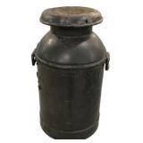 Antique black metal milk can