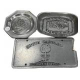 Pewter decorative items featuring thematic designs