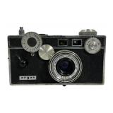 A black pebbled or textured faux leather camera