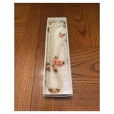 Faux pearls necklace, bracelet, and earrings set