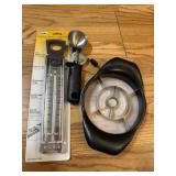 Candy thermometer, ice cream scoop, pineapple