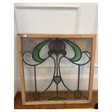 Leaded stained glass window with corner crack