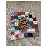 Mini handmade doll quilt and old wooden spools