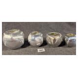 Four Italian Cast Aluminum Candles