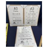 Three 11 x 16 wood frames new in package