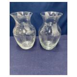 2 glass flower vases 8 inches tall