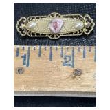 Gold tone pin brooch with pink rose and faux