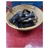 Basket full of bottle openers, corks, mixing