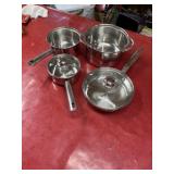 Stainless steel pots and pans, some glass lids