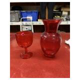 Red glass goblet and vase