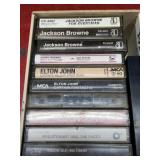 Vintage music cassette tapes in old cigar box