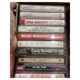Vintage music cassette tapes in cigar box