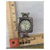 Geneva Silvertone cuff watch with hinges,