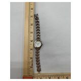 Unmarked Watch with numbers on rim of clock face
