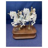 Music box w porcelain boy, and girl on carousel