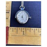 Oval watch on 28 inch silvertone chain faux tiger