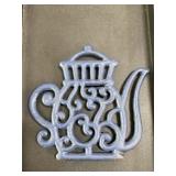 Vintage dark blue cast iron trivet