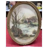 Oval framed cottage scene 13x17
