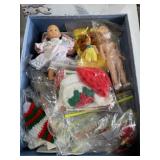 Box of vintage baby dolls and craft accessories