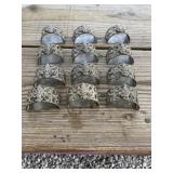 12 metal napkin rings? marked ITALY unknown metal