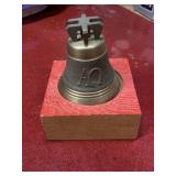 Vintage bronze bell with wooden holder