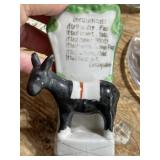 Vintage ceramic weather donkey has paint wear
