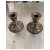 2 Sterling silver weighted candlestick holders