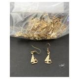 Many gold tone sailboat dangle earrings