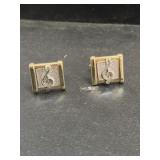 2 Silver and gold toned music note cufflinks