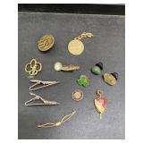Many vintage pins and tie clips