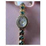 Ladies watch with green stones untested with