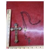 Wooden cross with Jesus and red heart rosary