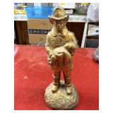 Plaster firefighter statue with chip in hat 14in