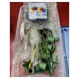 Box full with craft pins and sticks