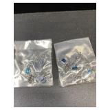Many silver tone seahorse dangling earrings with