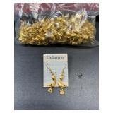 Many gold tone pelican dangle earrings