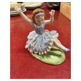 Vintage porcelain figurine girl in blue dress