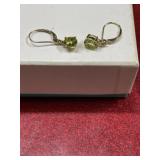 Gold tone with light green gem stone pierced
