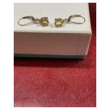 Gold tone with light yellow gem stone pierced