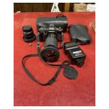 Vintage Yashica FX-103 camera with accessories